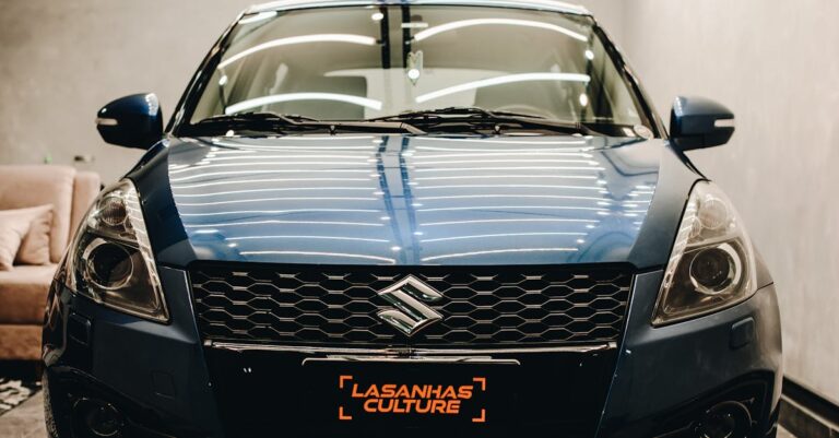 Stylish blue Suzuki Swift captured in a contemporary garage setting.